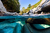 View beneath the water surface of the mountain river Verzasca near Lavertezzo in the Swiss Alps, Canton of Ticino, Switzerland
