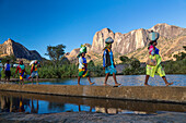 Madagascan women in front of the Tsaranoro Massif, highlands, South Madagascar, Africa