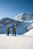 Two skiers ascending, Turtmann valley, Canton of Valais, Switzerland