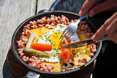 Roesti with fried egg in a pan, Canton of Valais, Switzerland
