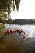 Competitive swimmers training in open water, Boberg swimming lake, Billwerder, Hamburg, Germany
