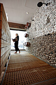 Woman inside a spa area with sauna in a hotel, HafenCity, Hamburg, Germany