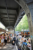 Market stalls below urban railway system, farmers market in Isestrasse, Eppendorf, Hamburg, Germany