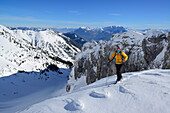Female backcountry skier ascending to Hinteres Sonnwendjoch, Mangfall Mountains, Bavarian Prealps, Tyrol, Austria