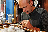 Painting faiences in an atelier in Rouen, Seine-Maritime, Normandy, France