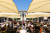 Pavement cafe, old stock exchange building in background, Leipzig, Saxony, Germany