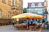 Guests in a pavement restaurant in the evening, Leipzig, Saxony, Germany