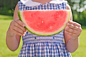 Girl Holding Slice of Watermelon