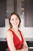 Woman Smiling in Kitchen, Toronto, Ontario