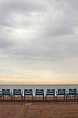France,  Provence-Alpes-Côte d'Azur, Nice, Promenade des Anglais (‘the Walkway of the English’),  Chairs along the beach