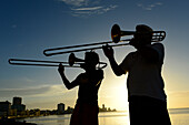 Two men playing trumpet at the Malecon in Havana, Cuba