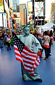 Statue of Liberty costume with american flag in Times Square,  New York City, New York State, United State, USA