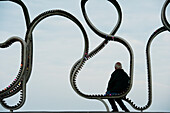 Man Sitting On 'the Longest Bench', Littlehampton, West Sussex, Uk