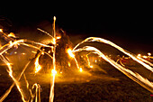 Burning Torches Being Thrown Onto The Large Bonfire At The Ewhurst And Staplecross Bonfire Society Bonfire Night, East Sussex, Uk