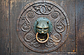 Detail on the entrance door to the cathedral of Augsburg, Swabia, Bavaria, Germany