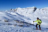 Female backcountry skier ascending to Birnhorn, Ebersbergkar, Leoganger Steinberge, Salzburg, Austria