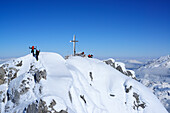 Two persons ascending Birnhorn summit, Berchtesgaden range in background, Birnhorn, Leoganger Steinberge range, Salzburg, Austria