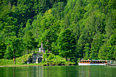 Electric boat crossing to Christleger island with memorial, lake Koenigssee, Berchtesgaden range, National Park Berchtesgaden, Berchtesgaden, Upper Bavaria, Bavaria, Germany