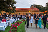 People enjoying the formal ball in the castle gardens, hosted by Erlangen University, Erlangen, Franconia, Bavaria, Germany