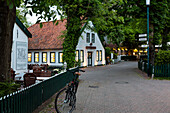 Street in Spiekeroog at dusk, Spiekeroog Island, Nationalpark, North Sea, East Frisian Islands, East Frisia, Lower Saxony, Germany, Europe