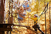 Boy in a high ropes course, Vernagt am See, Schnals Valley, South Tyrol, Italy