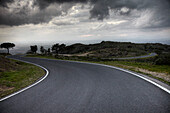 Bendy road in thunderstorm, Cap de Creus, Catalonia, Spain