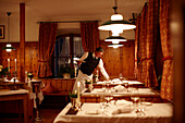 Waiter setting a table in a restaurant, Karthaus, Schnalstal, South Tyrol, Alto Adige, Italy