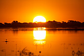View over Cuando River (Chobe River) to sunset, Chobe National Park, Botswana