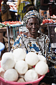 Woman offering soap at a market, Yanfolila, Sikasso Region, Mali