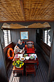 Man having lunch on a river steamer, Mekong river cruise, Cao Lanh, Dong Thap, Vietnam
