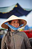 Woman selling coffee, floating market on Mekong river, Long Xuyen, An Giang Province, Vietnam