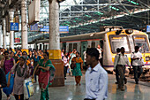 People getting off a train at Victoria Terminus, Mumbai, Maharashtra, India
