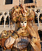 Portrait of a woman wearing traditional costume and mask, Carnival of Venice, Veneto, Italy