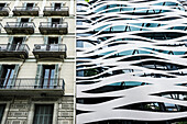 Modern and old facade of a building,Passeig de Gracia,Barcelona,Spain