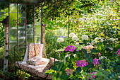 Garden still life with antique bed and summer flowers, Freiamt, Emmendingen, Baden-Wuerttemberg, Germany
