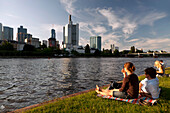 People relaxing on the banks of the Main, Frankfurt am Main, Hessen, Germany