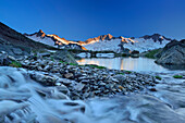 Mountain river flowing into lake Schwarzsee, Dritte Hornspitze, Turnerkamp and Grosser Moeseler in background, Zillertal Alps, valley Zillertal, Tyrol, Austria