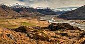 Panorama from tussock grass hills above Matukituki River, Black Peak  left and Mt Aspiring right, near Wanaka, Otago