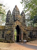 Angkor Thom, located in present day Cambodia, was the last and most enduring capital city of the Khmer empire. It was established in the late twelfth century by king Jayavarman VII. It covers an area of 9 km², within which are located several monuments fr