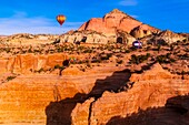 Aerial view of hot air balloons flying during the Red Rock Balloon Rally, Red Rock State Park, near Gallup, New Mexico USA
