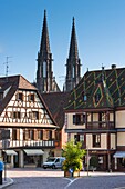 Timbered houses with the church Saint Pierre and Saint Paul in the background, Obernai, Alsace, France