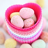 an image for Easter, candy eggs and hearts, colourful and fresh