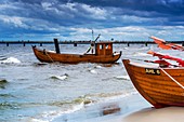 Two Fishing boats at the beach of the Baltic Sea, near the pier of the Baltic Sea resort of Ahlbeck, Municipality of Heringsdorf, Usedom Island, County Vorpommern-Greifswald, Mecklenburg-Western Pomerania, Germany, Europe, No Property Release available!