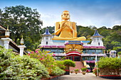 Sri Lanka - Dambulla, Golden Buddha statue over the Buddish Museum, Kandy province, UNESCO World Heritage Site, central region of Sri Lanka Island