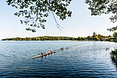 Kayakers on lake Ratzeburg with the cathedral of Ratzeburg in the background, Ratzeburg, Schleswig-Holstein, north Germany, Germany