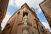 Statue Of The Virgin And Child On A Corner Of The Carmelite Church, Mdina, Malta