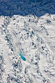 Aerial View Of A Glacier Moraine And Melt Water Pond, Coastal Mountain Range North Of Haines, Southeast Alaska, Summer