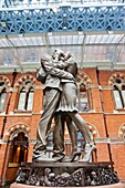 'UK, England, London, Kings Cross, St Pancras Station, ''The Meeting Place'' Sculpture by Paul Day'