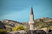 Minaret rising above the fortress wall at Stari Bar, old town of Bar, Adriatic coastline, Montenegro, Western Balkan, Europe