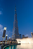 Fountain display in front of Burj Khalifa at dusk, Dubai, UAE